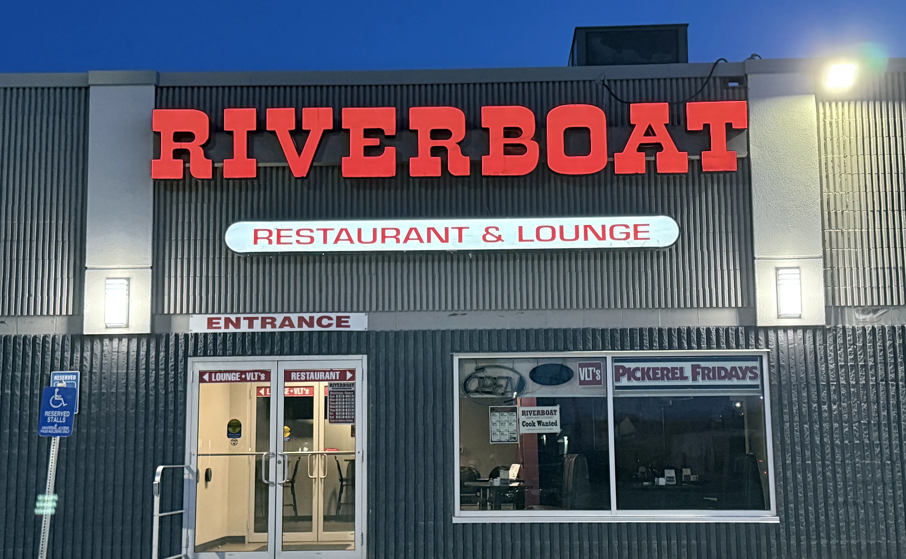 Riverboat Family Restaurant storefront at 366 Main Street, Selkirk, in the evening