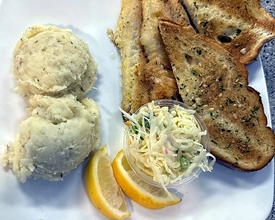 Pickerel fillets with mashed potatoes, coleslaw, garlic toast and lemon
